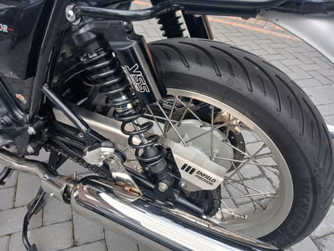 Close-up of the footrest hangers, gear lever and exhaust header