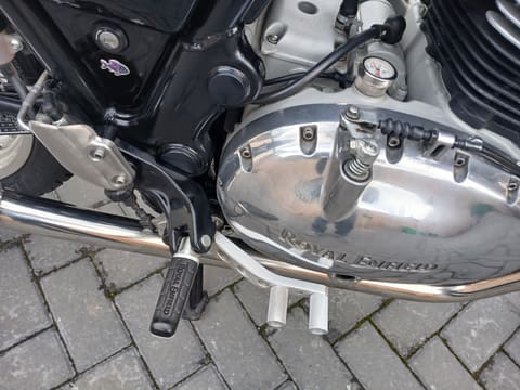 Close-up of the engine casing, gear lever and passenger footpegs